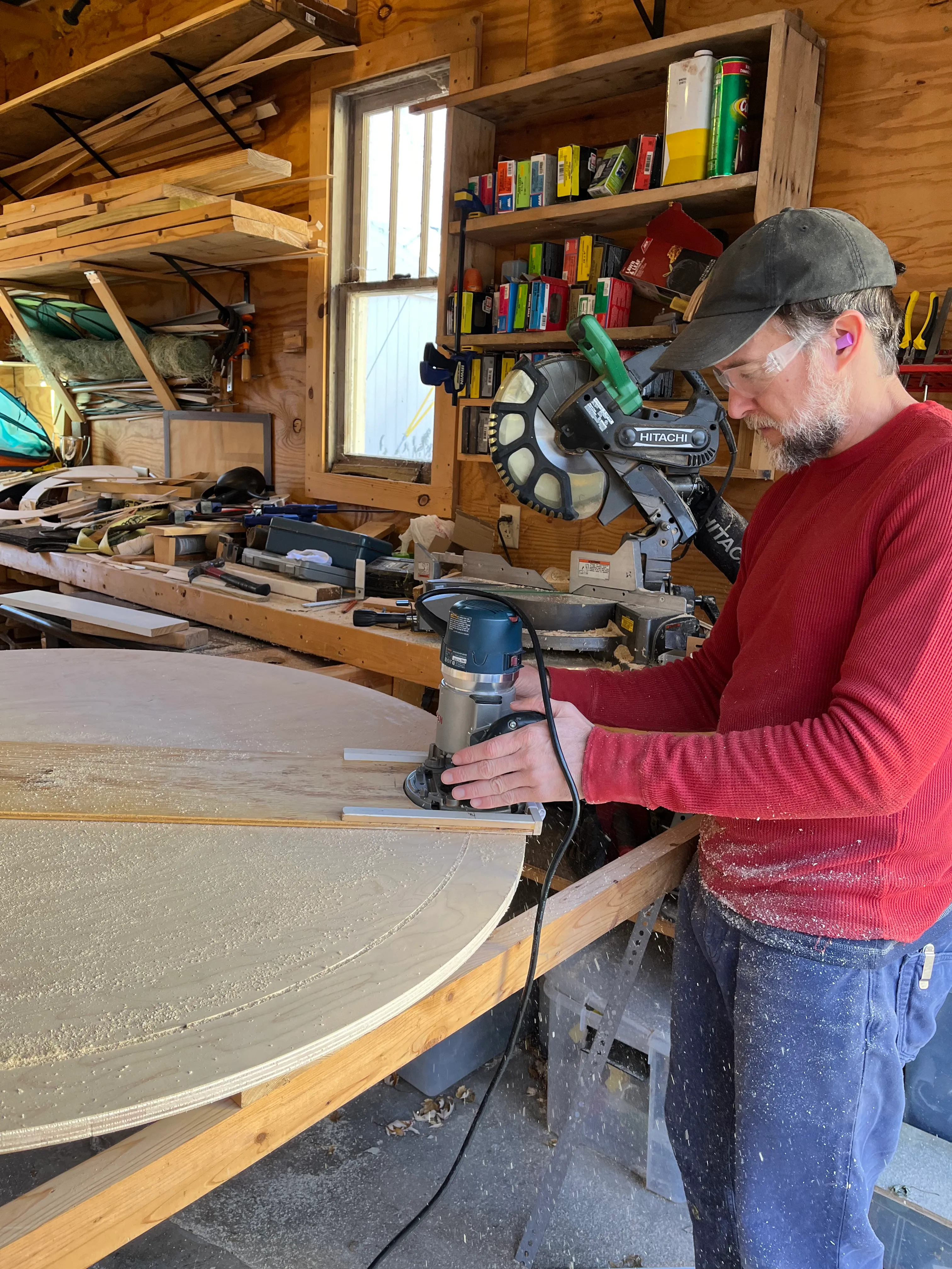 Large plywood rings being routed in the workshop