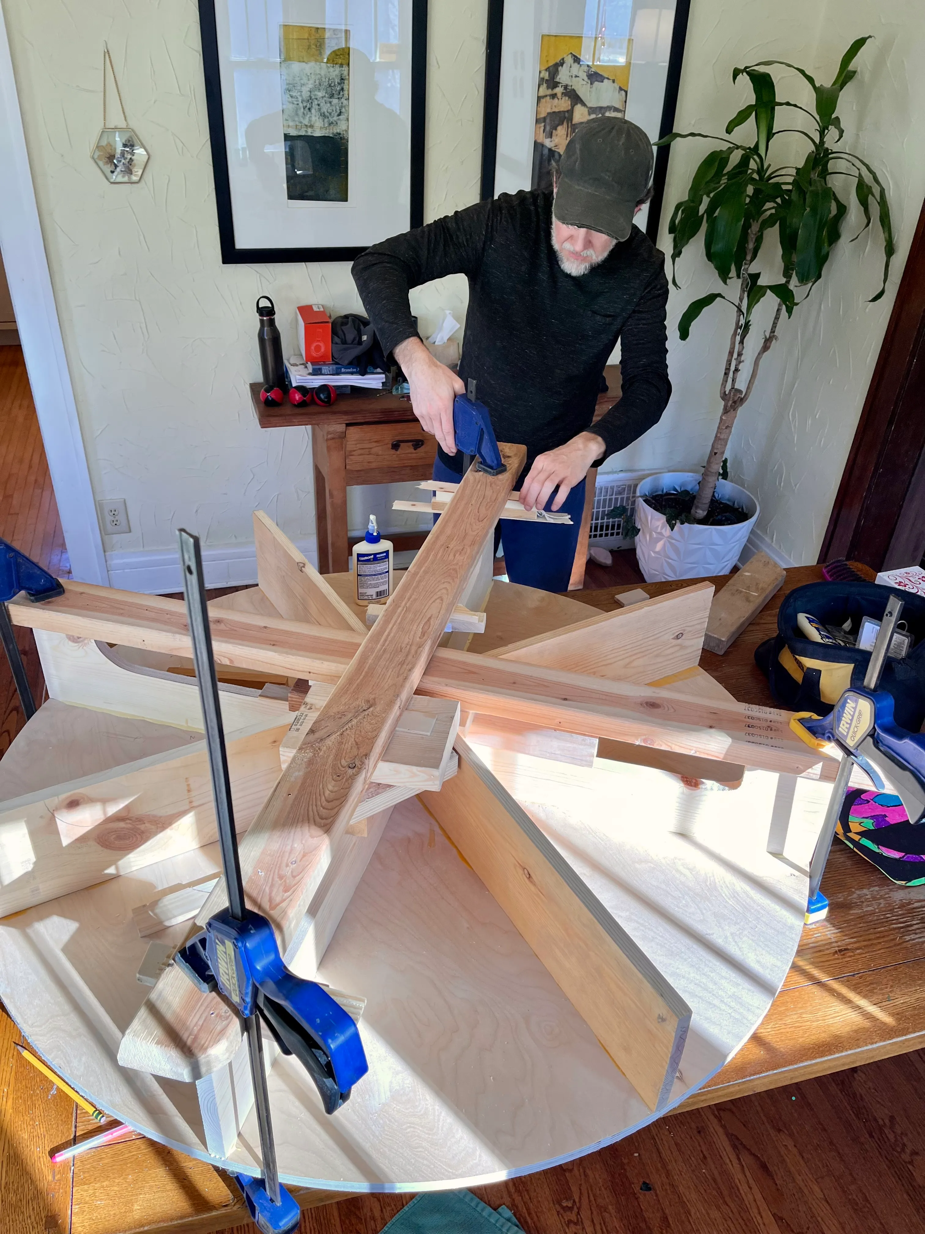 Large circular base framework being glued and clamped together